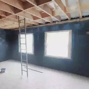 Blowerproof roof wall join